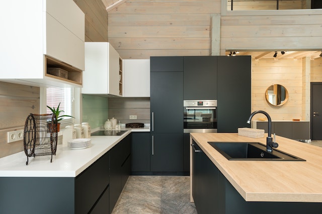 carrollton-rental-home-indoor-modern-black-kitchen-with-wood-accents