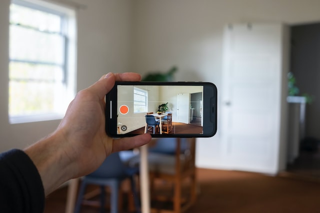 a-person-pointing-a-phone-camera-in-landscape-mode-towards-a-kitchen