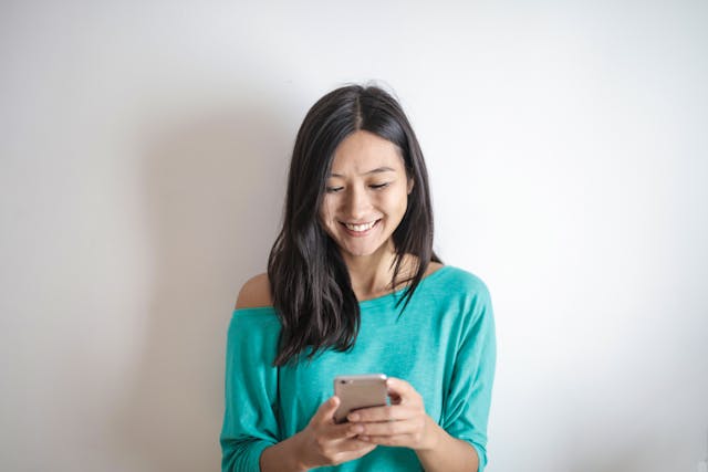 woman texting on her phone